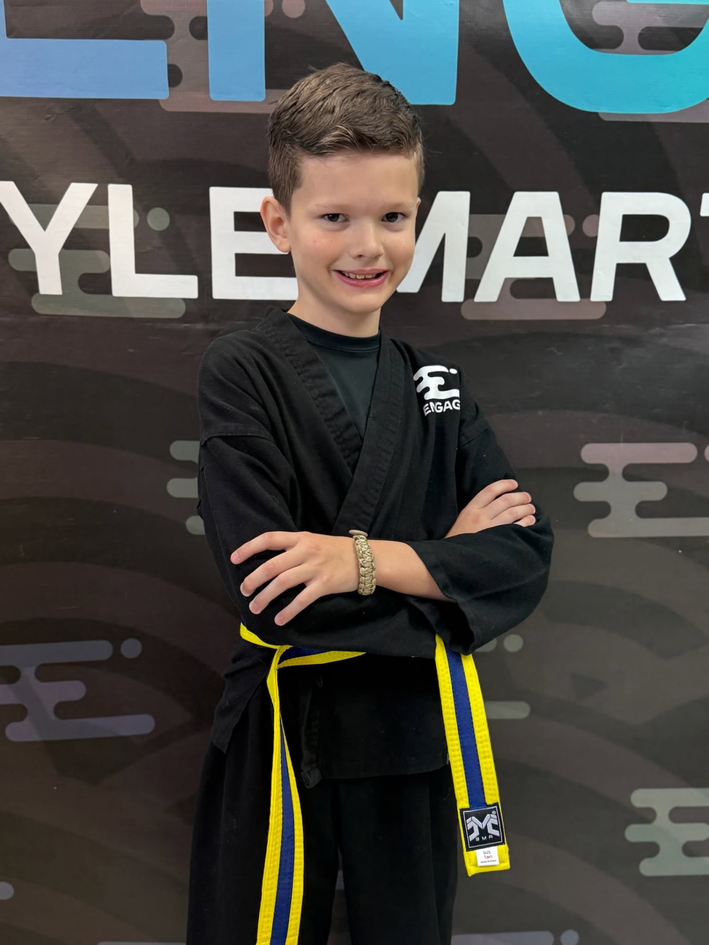 Young Engage Lifestyle Martial Arts student in black uniform with yellow belt in Henderson NV