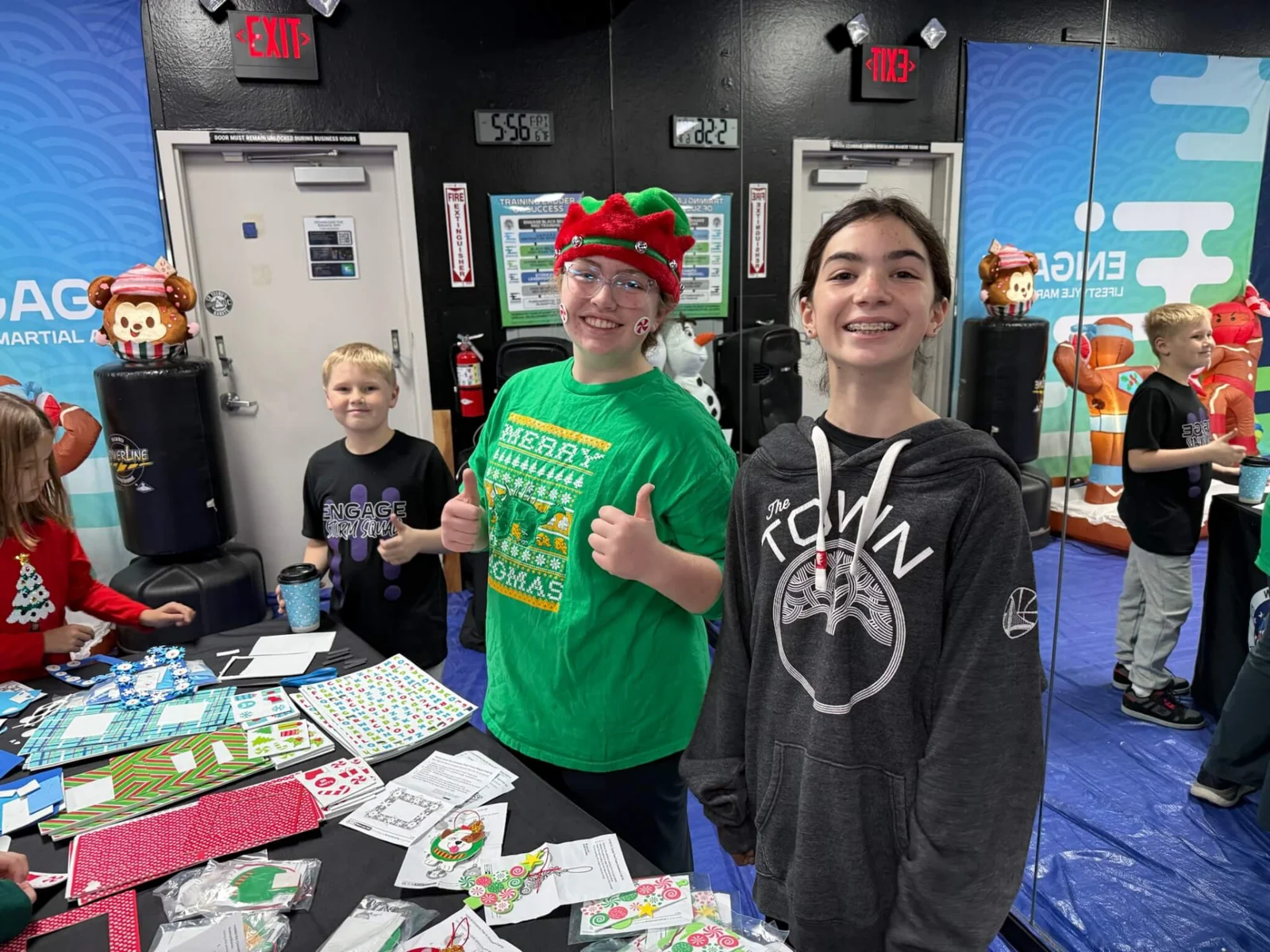 Families enjoying the holiday craft table at Engage Lifestyle Martial Arts