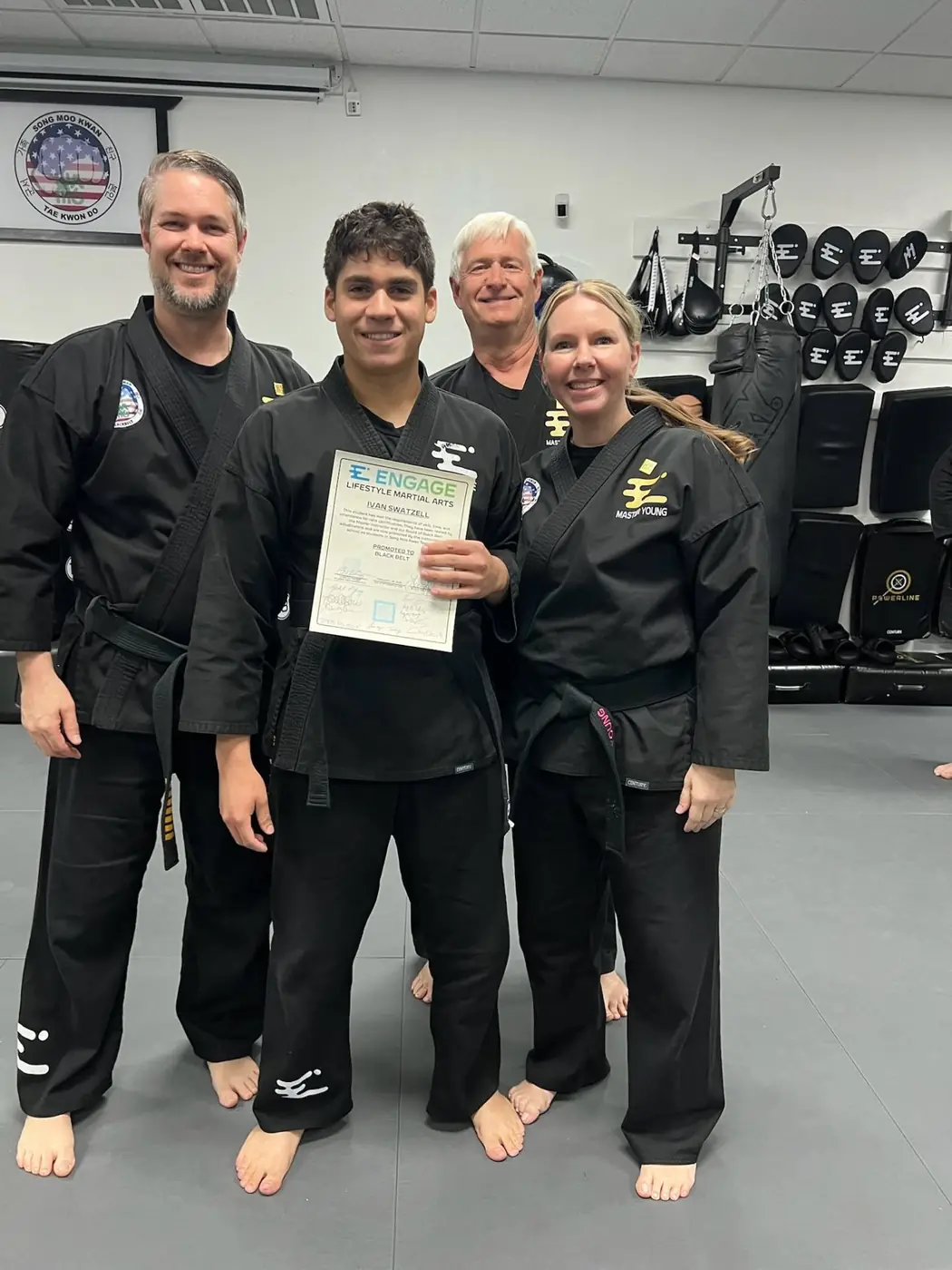 Engage student celebrating a black-belt milestone in Henderson