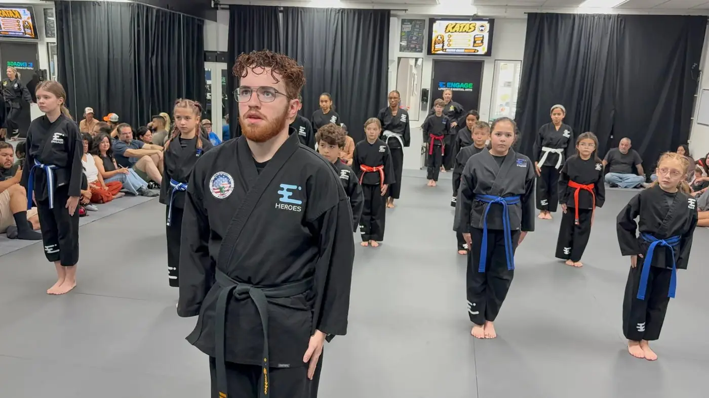 Engage Lifestyle Martial Arts class standing in unison ready stance at the Henderson NV dojo